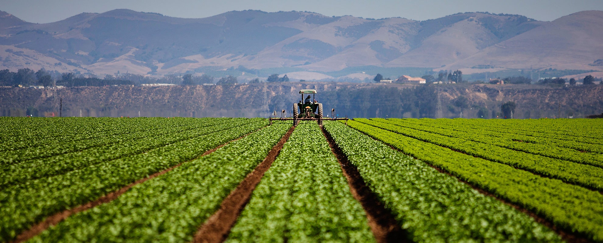 A tractor works a farm field in Southern California. A tractor works a farm field in Southern California.