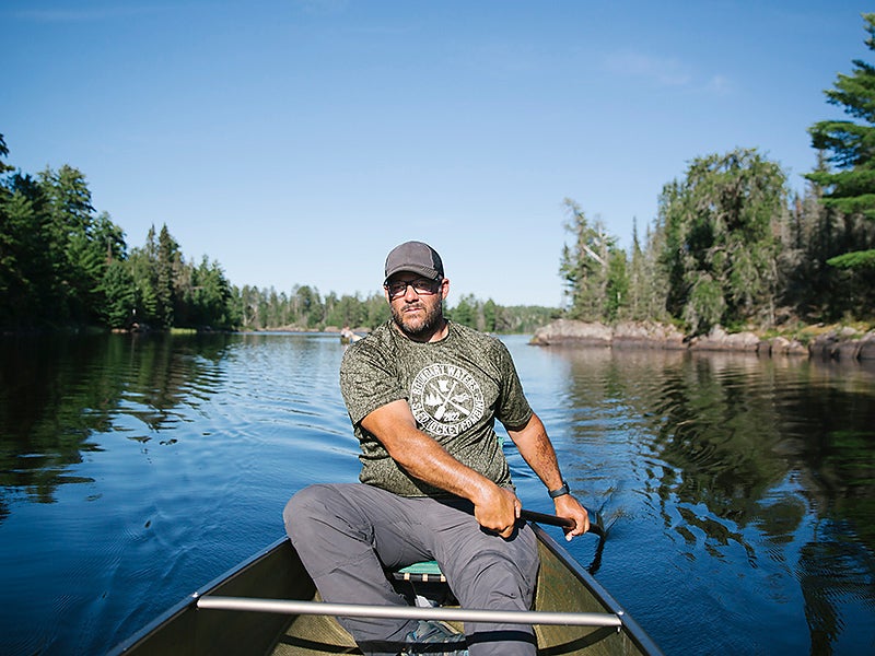Boundary Waters guide Dave Hicks paddling his canoe through the wilderness area.