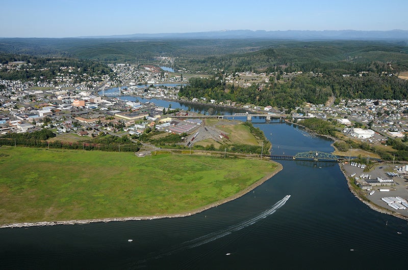 An aerial view of Grays Harbor, WA, where planned crude oil terminals threaten treaty-protected fishing and gathering rights.