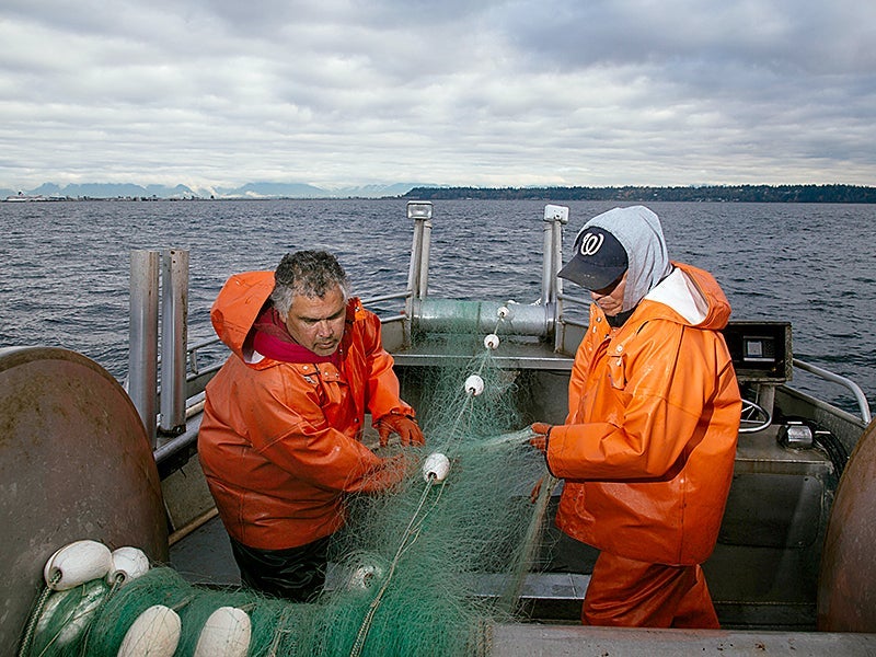 Jim Kelly and Dana Wilson, members of the Lummi Nation, fish for chum salmon in the Salish Sea.