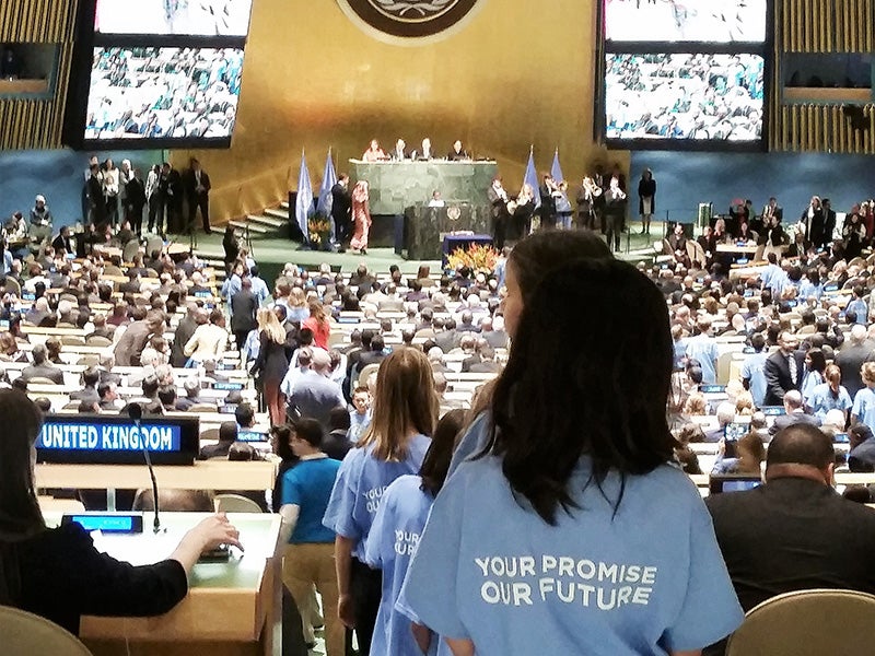 Schoolchildren, all wearing shirts with the words: “Your Promise, Our Future,” streamed down the aisles at the close of the Paris Agreement signing ceremony at the UN General Assembly in New York, April 22, 2016.