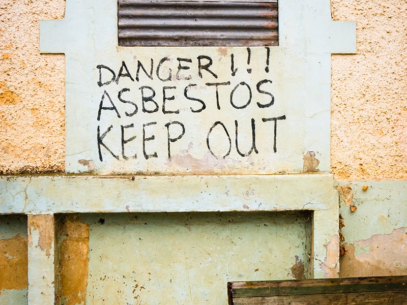 A sign warning of the presence of asbestos.