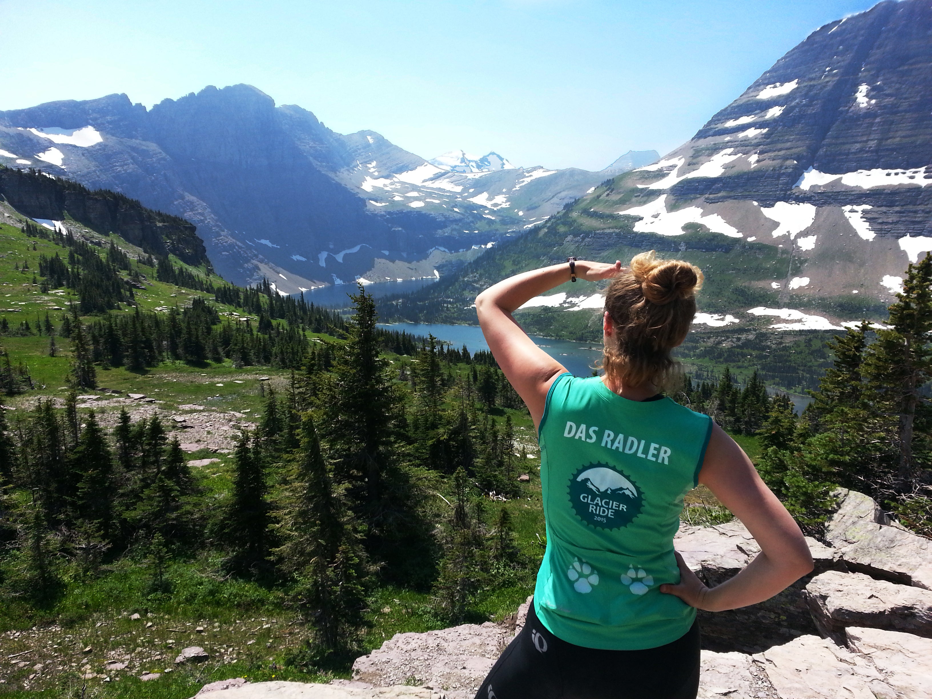 Earthjustice's Jessica Knoblauch looks across a valley toward declining snowpacks in Montana's Glacier National Park.