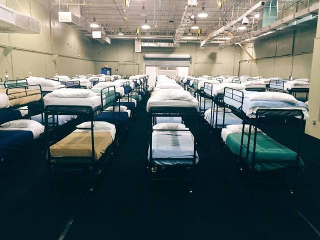 Photo of hundreds of bunk beds in the dormitory at Homestead Detention Center, Biscayne, Florida.