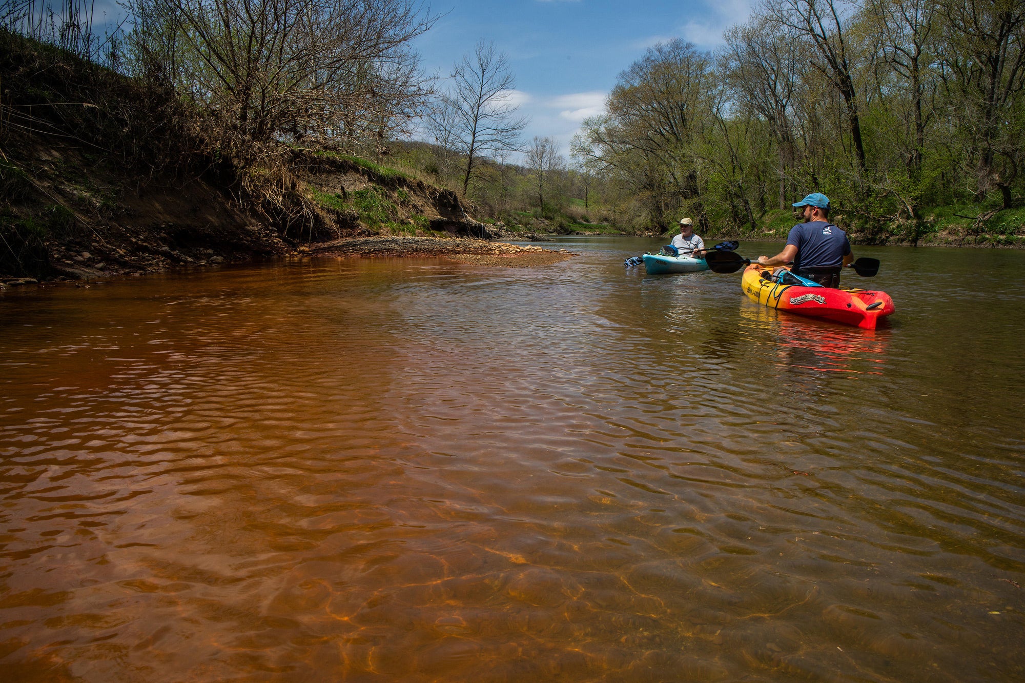 Andrew Rehn, right, of the Prairie Rivers Network and Lan Richart of Eco-Justice Collaborative paddle past toxic coal ash waste seepage on the Vermilion River in Illinois.