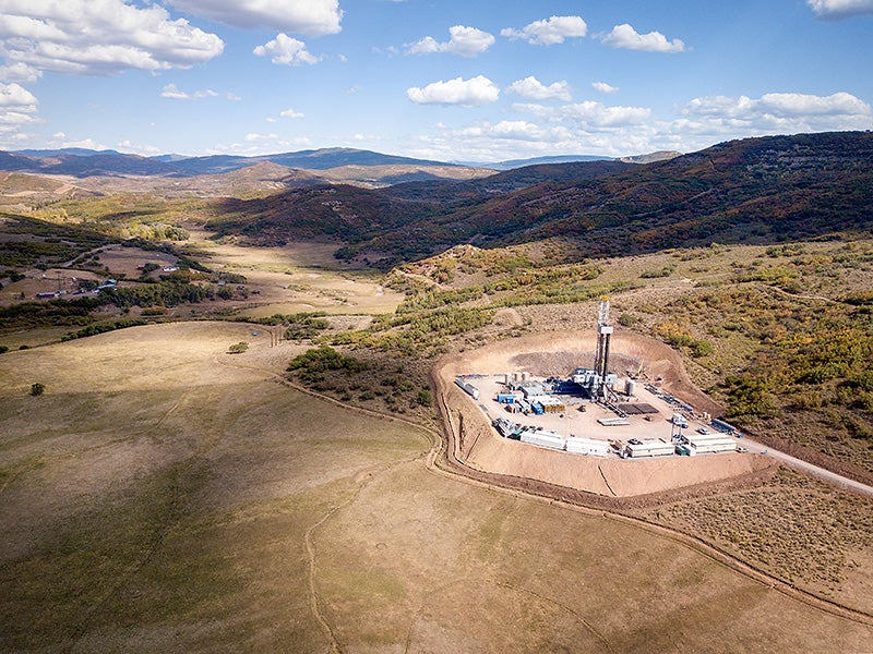 A fracking drill rig set in the Colorado Rocky Mountains. A fracking drill rig set in the Colorado Rocky Mountains.