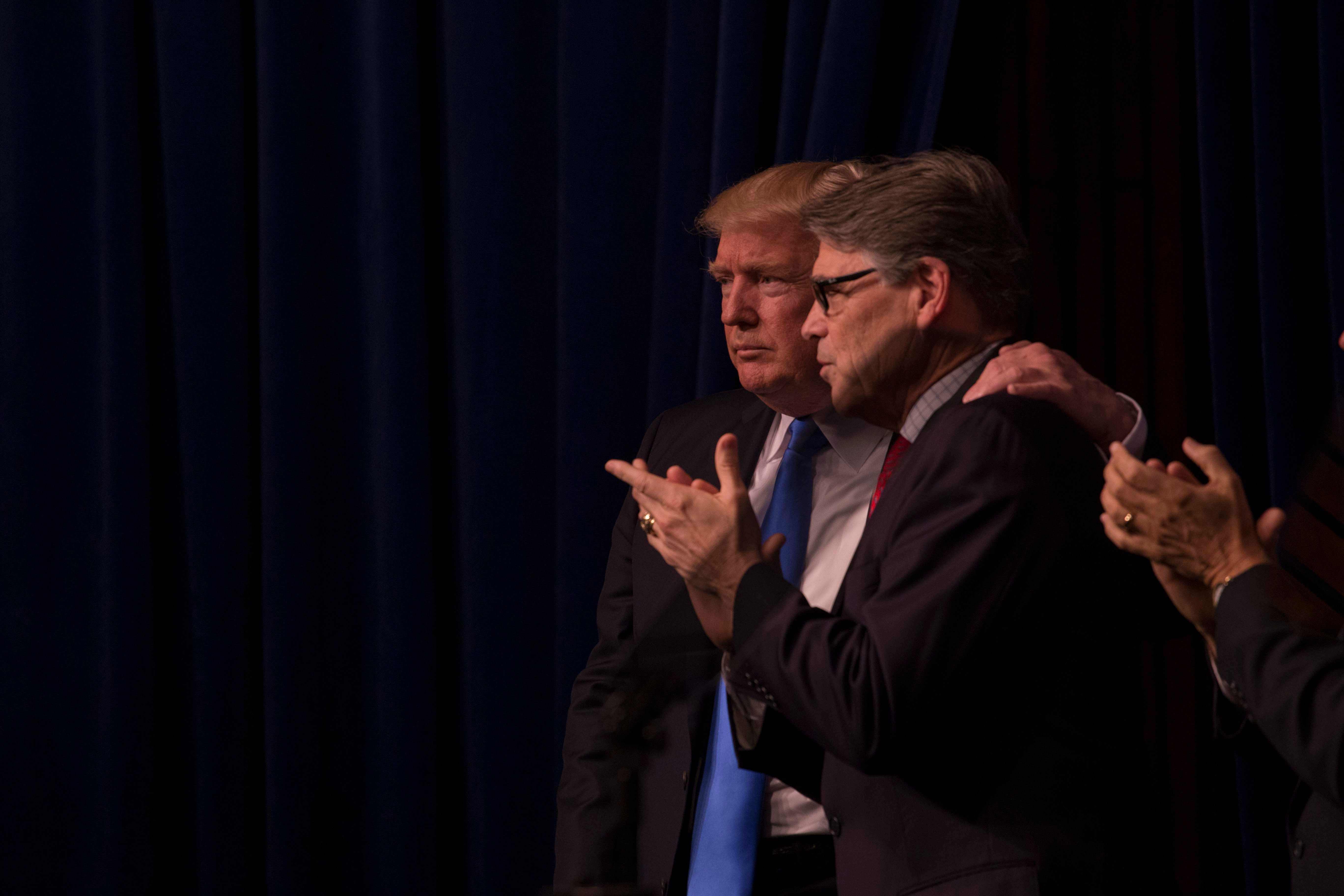 President Donald Trump and Secretary of Energy Rick Perry share a moment. President Donald Trump and Secretary of Energy Rick Perry share a moment.