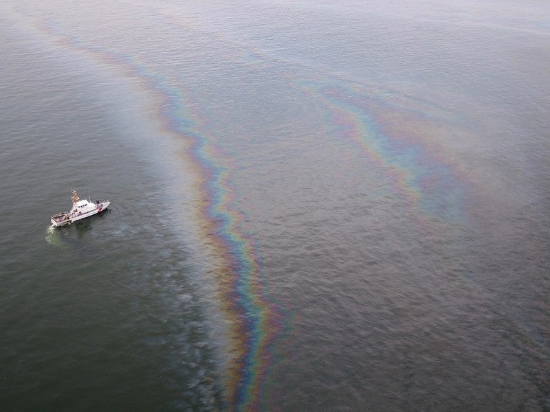 A boat monitors the oil sheen from the Taylor Energy leak. A boat monitors the oil sheen from the Taylor Energy leak.