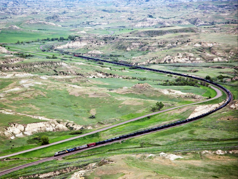 A 90+ car train carries Bakken crude oil near De Mores, ND. A 90+ car train carries Bakken crude oil near De Mores, ND.