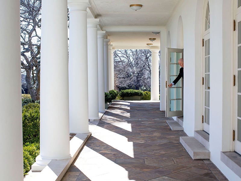 Then-Vice President Joe Biden opens a door from the Outer Oval Office onto the Colonnade of the White House on his way to a National Governors Association meeting, Feb. 24, 2014.