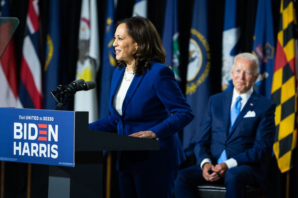Photo of Senator Kamala Harris speaking, with Joe Biden seated in the background, in Wilmington, Del., following the announcement of her candidacy for vice president of the United States on August 12, 2020.