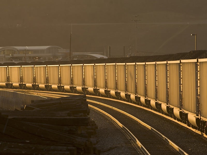 Loaded coal hoppers at sunset. Loaded coal hoppers at sunset.