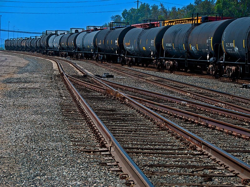 An train carrying oil travels through California.