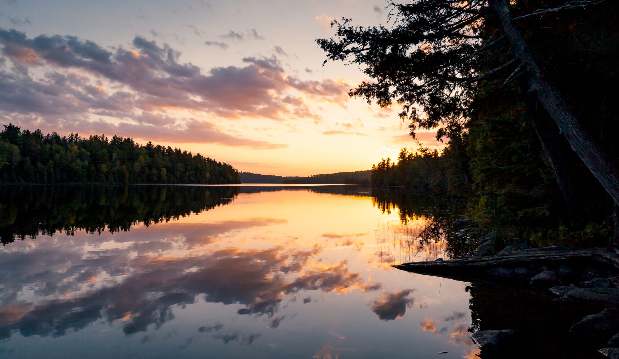 The sun sets over Alder Lake in the Boundary Waters Canoe Area Wilderness in Minnesota.
