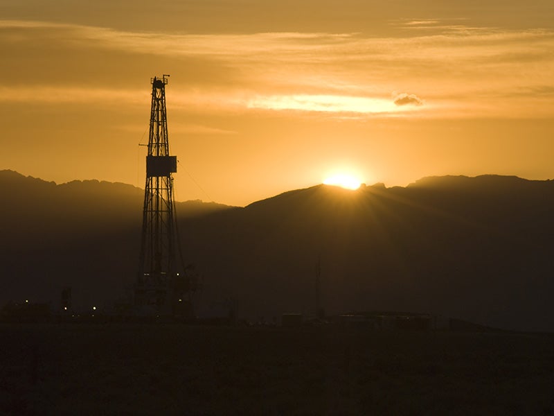 A drill rig at sunrise.