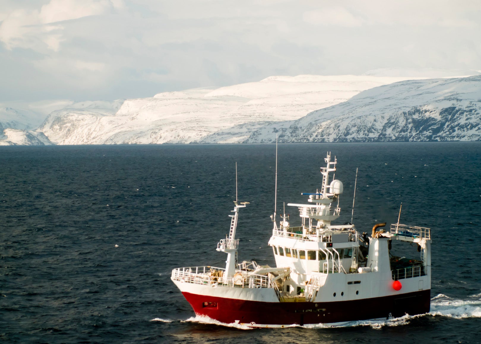 A fishing boat on the Barents Sea off the coast of Norway. A fishing boat on the Barents Sea off the coast of Norway.