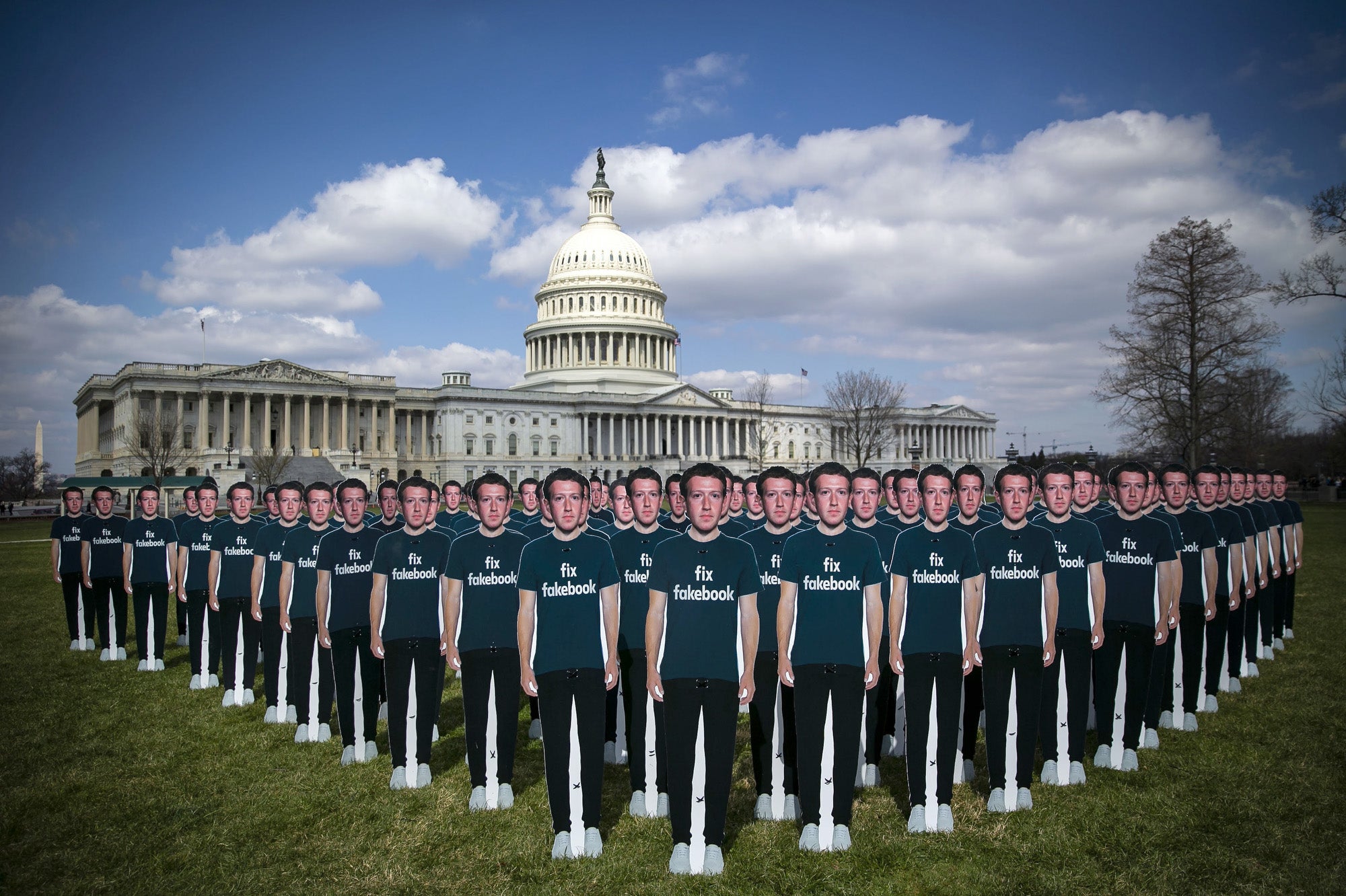 Cutouts of Facebook CEO Mark Zuckerberg are displayed on the South East lawn of the Capitol building
