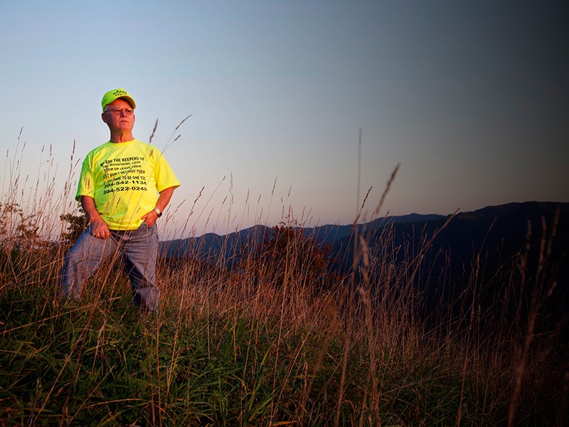 Larry Gibson, watching the sun set over a decimated Kayford Mountain. Larry Gibson, watching the sun set over a decimated Kayford Mountain.