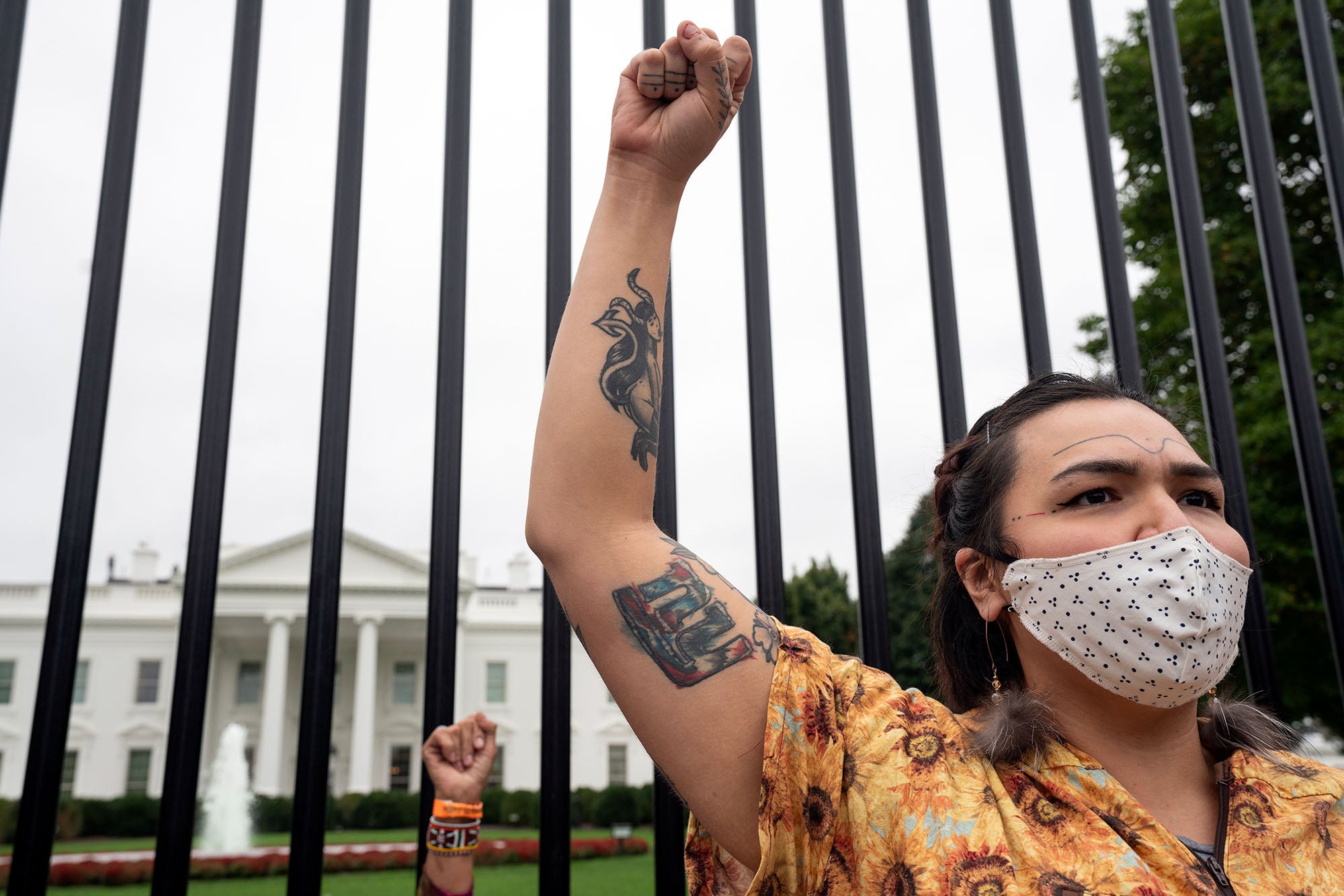 Earthjustice partner Siqiniq Maupin advocates against the Willow Project and other fossil projects outside the White House on Indigenous Peoples' Day 2021