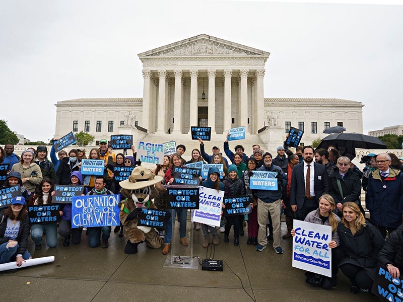Several hundred people braved the cold and rain for a "Protect Our Waters" rally at the U.S. Supreme Court in Washington, D.C., on Oct. 3, 2022, as oral arguments were heard in Sackett v. EPA. Several hundred people braved the cold and rain for a "Protect Our Waters" rally at the U.S. Supreme Court in Washington, D.C., on Oct. 3, 2022, as oral arguments were heard in Sackett v. EPA.