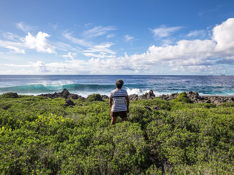 Deborah Fleming, a member of the Tinian Women Association, looks out onto the Pacific Ocean from the island of Tinian. Deborah Fleming, a member of the Tinian Women Association, looks out onto the Pacific Ocean from the island of Tinian.