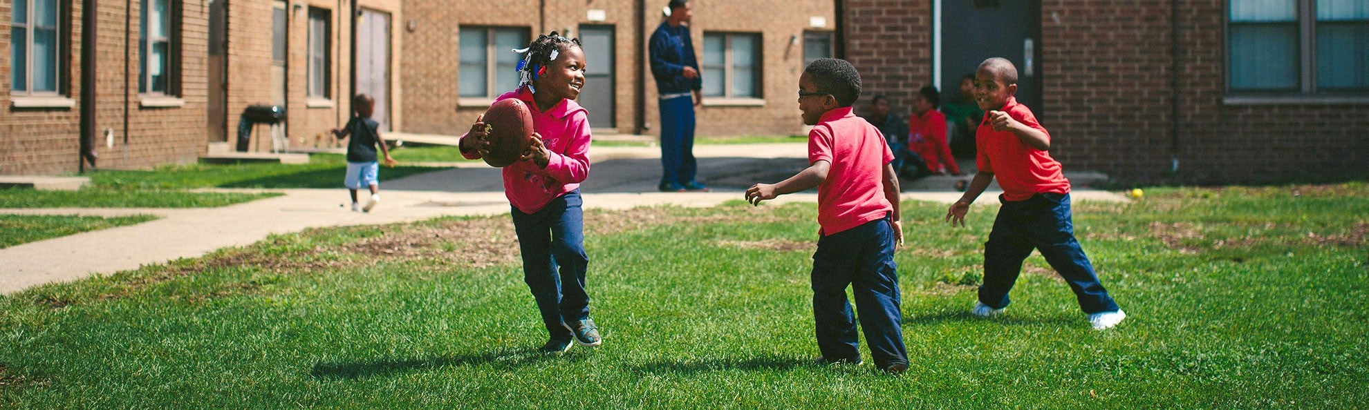Children play at the West Calumet Housing Complex in East Chicago, Ind., in 2016.