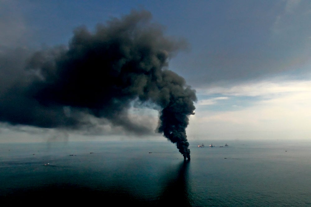 Smoke billows from controlled oil burns near the site of the BP Deepwater Horizon oil spill in June 2010.