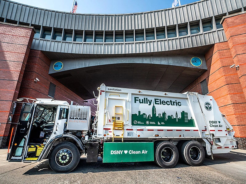 A Mack LR Electric garbage truck operated by the New York City Department of Sanitation.