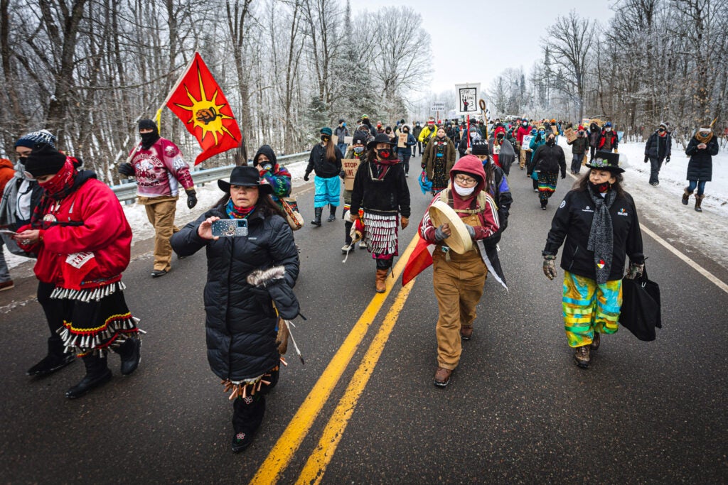 Native women lead hundreds of marchers to a spot near where the Line 3 pipeline will cross under the Mississippi River during a protest on Jan. 9, 2021.
(Ben Hovland)
