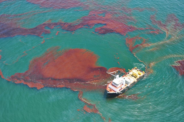 A "vessel of opportunity" skims oil spilled after the Deepwater Horizon well blowout in the Gulf of Mexico in April 2010. A measure on Florida's ballot this fall could help to prevent future spills.