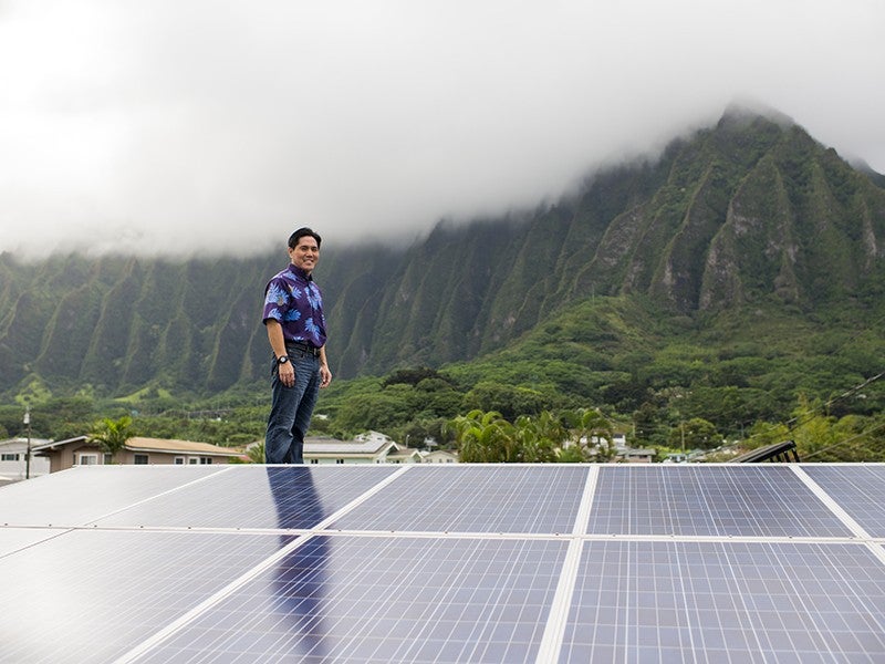 Earthjustice managing attorney Isaac Moriwake stands on his O‘ahu rooftop, which has been retrofitted with solar panels. In 2016, Hawai‘i’s Public Utilities Commission rejected the $4.3 billion sale of the state’s main utility company to out-of-state profiteers.
(Matt Mallams for Earthjustice)