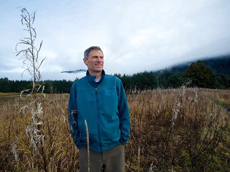Tom Waldo, one of the legal architects of Earthjustice&#039;s Roadless Rule strategy, walks through a field of fireweed near Juneau, Alaska.
