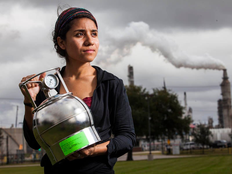 Activist Yudith Nieto holds an air sampler in Hartman Park, in the Manchester neighborhood of Houston, Texas.