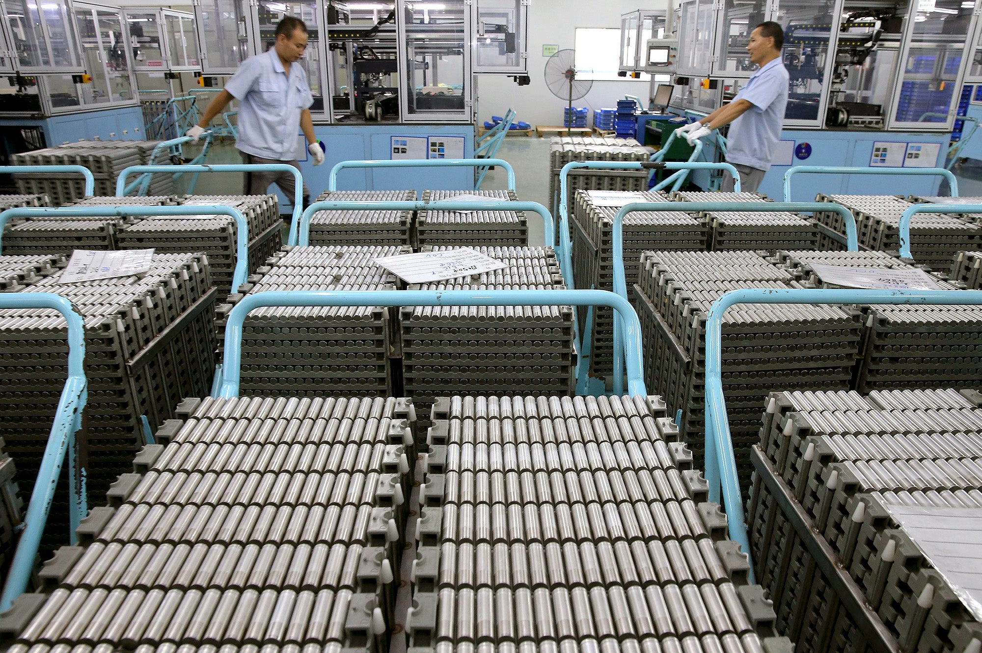 Workers transfer Lithium-ion batteries in a factory in Taizhou in east China's Jiangsu province.