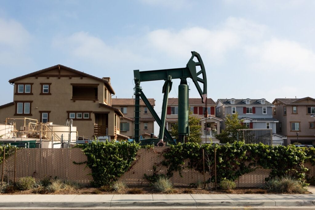 Signal Hill, an affluent suburb of Long Beach, features dozens of active oil wells and derricks around the town many in commercial parking lots and residential areas only feet from homes.  (Tara Pixley for Earthjustice)