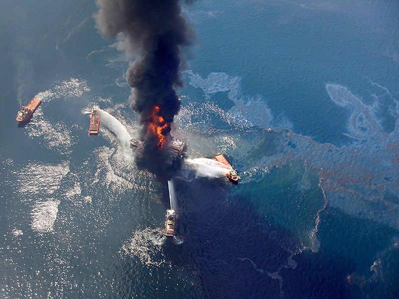 The Deepwater Horizon oil rig burns and releases oil on April 21, 2010, in the Gulf of Mexico.