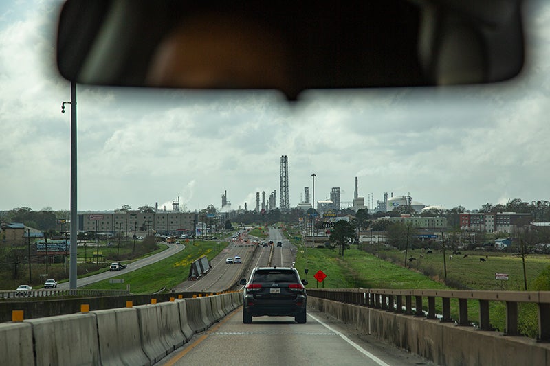 A view from the road of Cancer Alley, an area filled with oil refineries and petrochemical plants and where people have higher rates of disease.