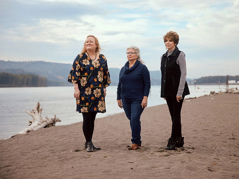 Sally Keely, Diane Dick, and Linda Horst photographed on the bank of the Columbia River near Kalama, Washington.