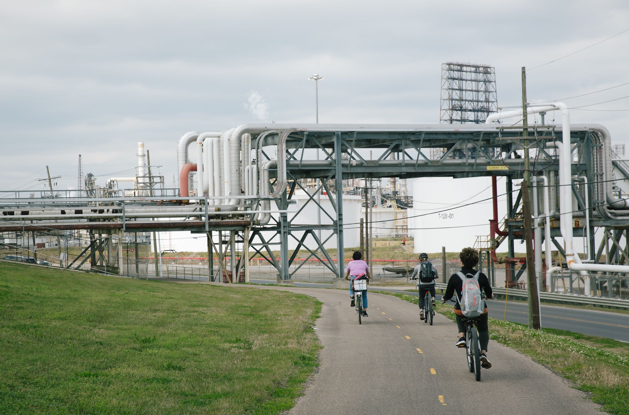 A Louisiana Bucket Brigade bicycle tour in Norco, Louisiana, on Mar. 16, 2022, cycles by oil and gas infrastructure.