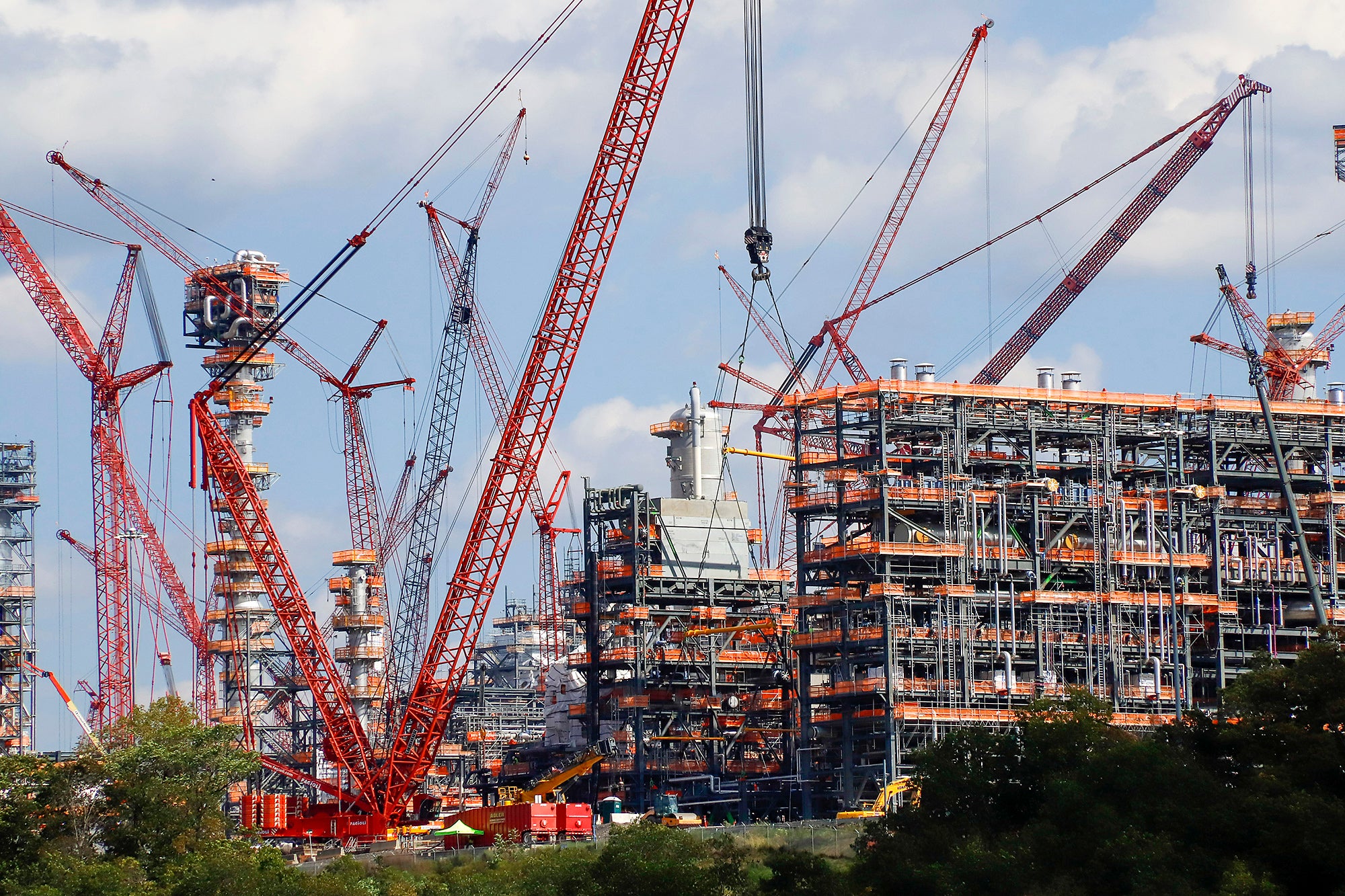 Cranes are seen as they work on construction of the Shell Pennsylvania Petrochemicals Complex and ethylene cracker plant located in Potter Township, Pa, from across the Ohio River, in this file photo from, Oct. 3, 2019, in Industry, Pa.
