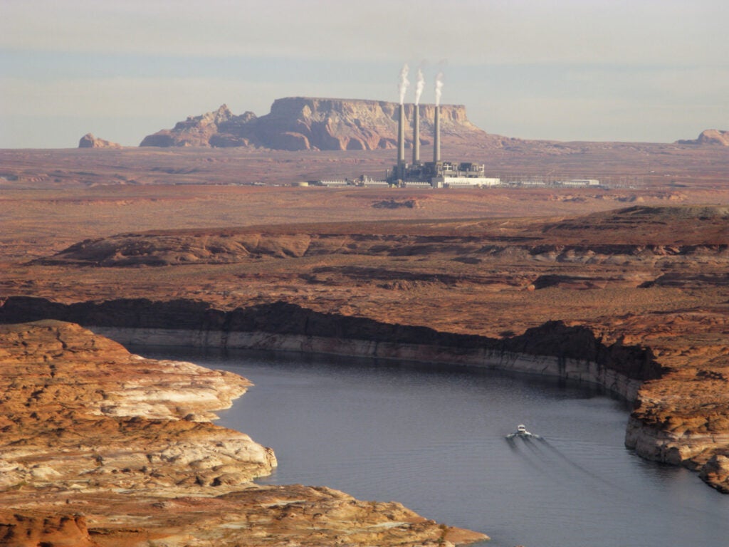 The Navajo Generating Station, near Page, Ariz., sits in haze behind Lake Powell.