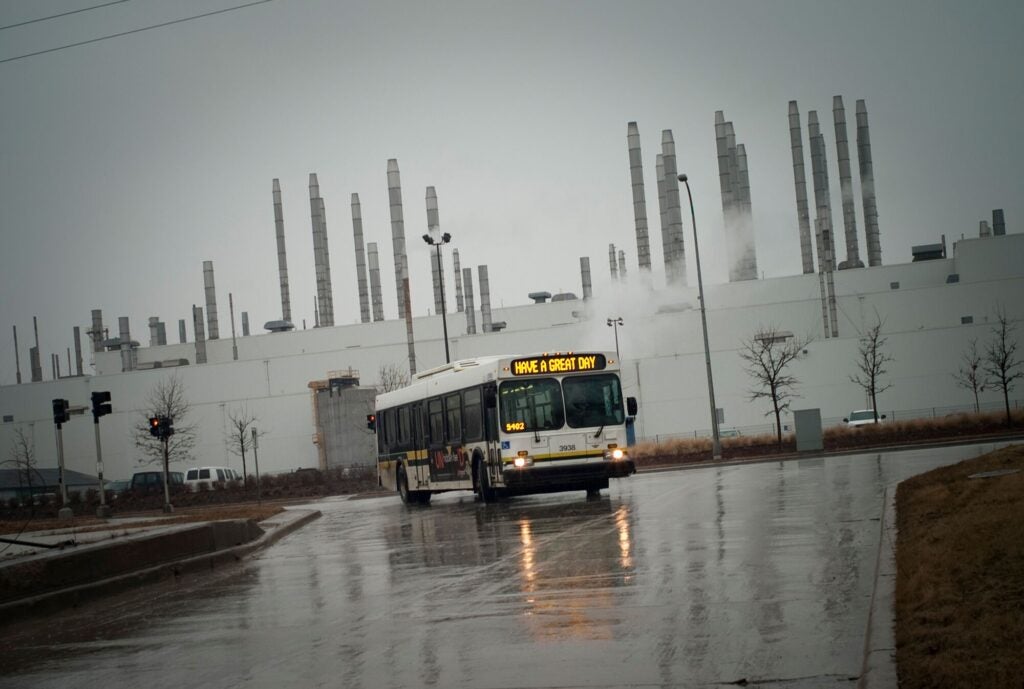 A city bus drives past the Ford Rouge River Plant in Dearborn, Michigan, in 2009.