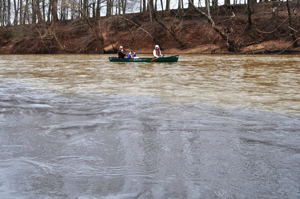 Volunteers collect water samples, as miles of the Dan River in North Carolina were contaminated with toxic coal ash after the collapse of a coal ash impoundment at Duke Energy's Dan River Steam Station in 2014. (Appalachian Voices)