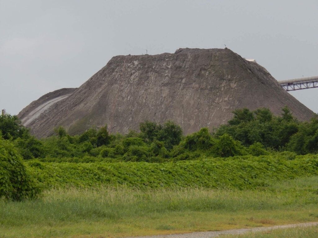 A five-story pile of coal ash lies next to the AES-PR power plant in the southern town of Guayama, Puerto Rico. (Mabette Colón)