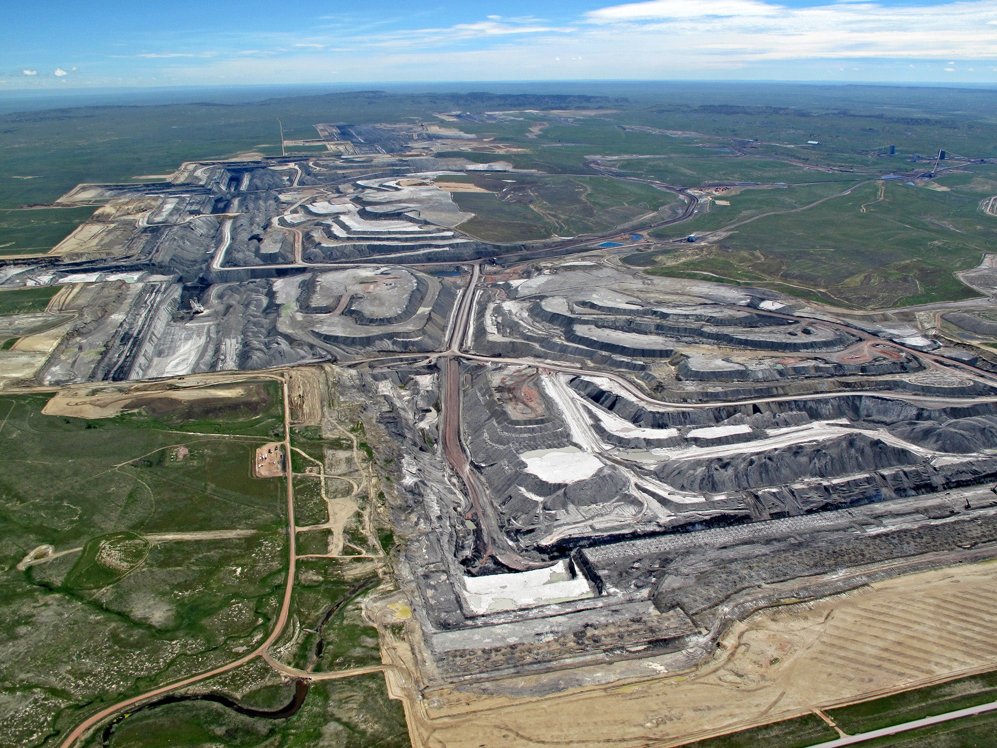 Landscape aerial photo of large open pit coal mine.