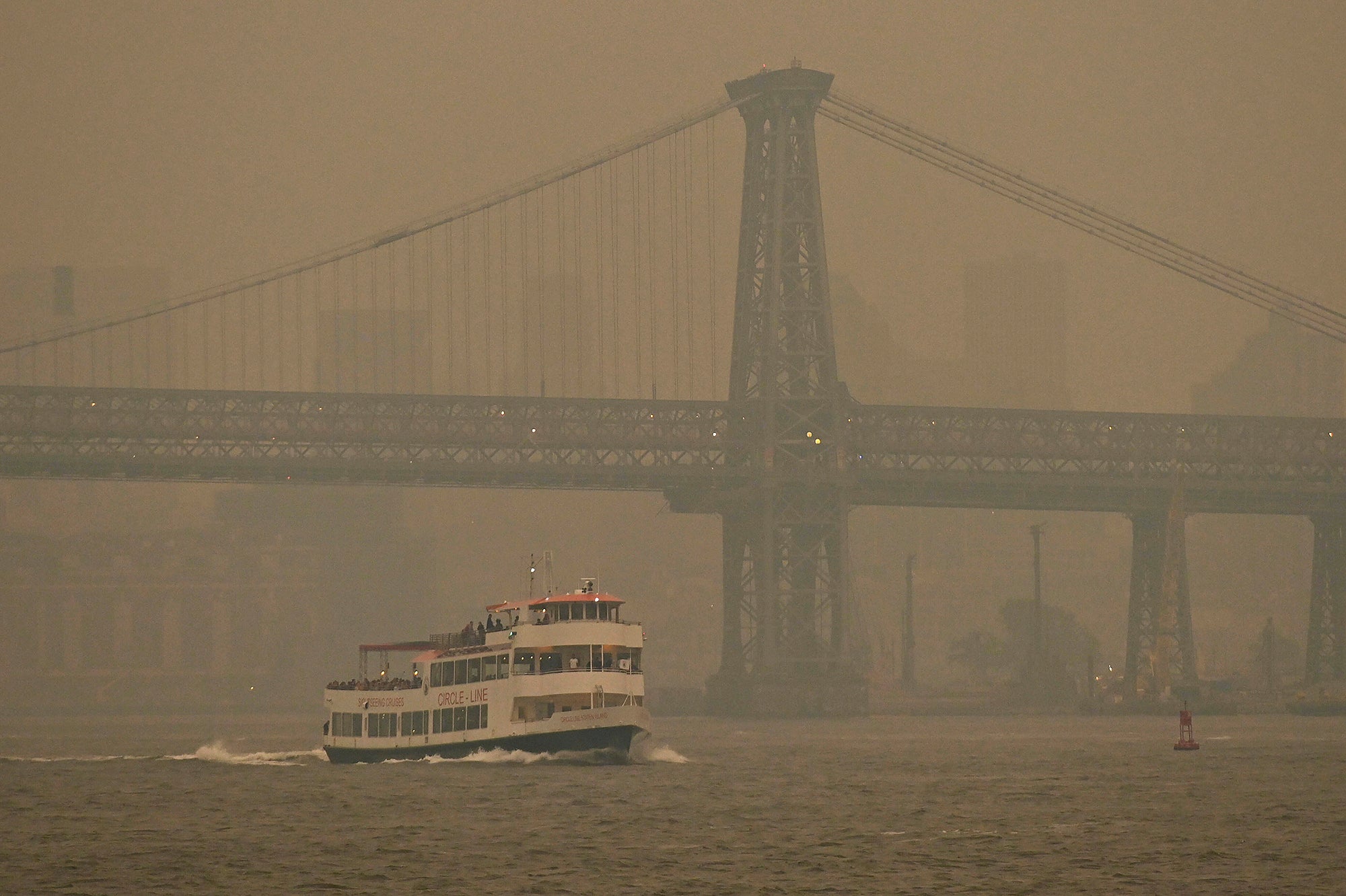 Gray and yellowish smoke limits visibility in photo.