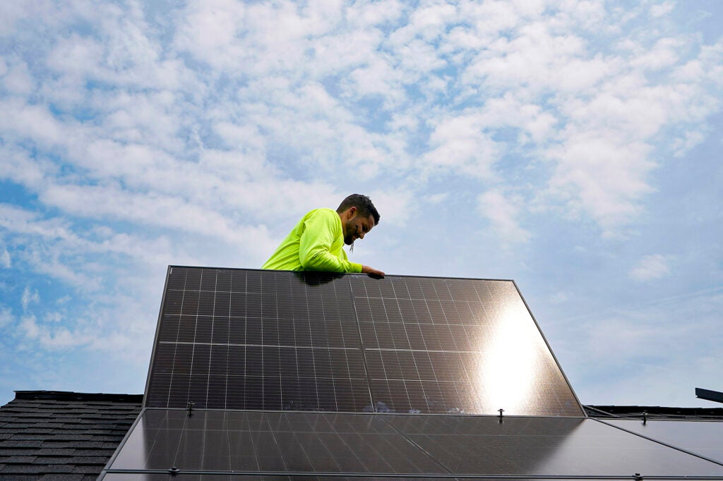 Solar panels being installed on the roof of a home in Frankfort, Ky., Monday, July 17, 2023. (Michael Conroy / AP)