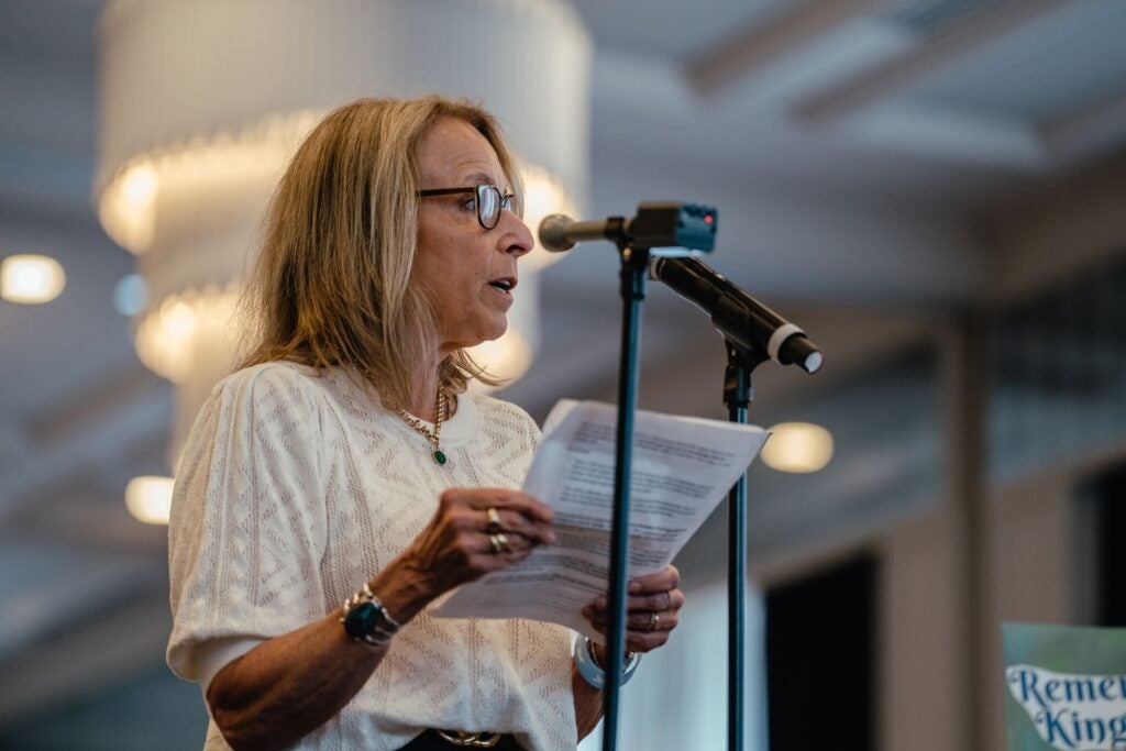 Earthjustice attorney Lisa Evans stands before a microphone to speak at an EPA hearing on coal ash.