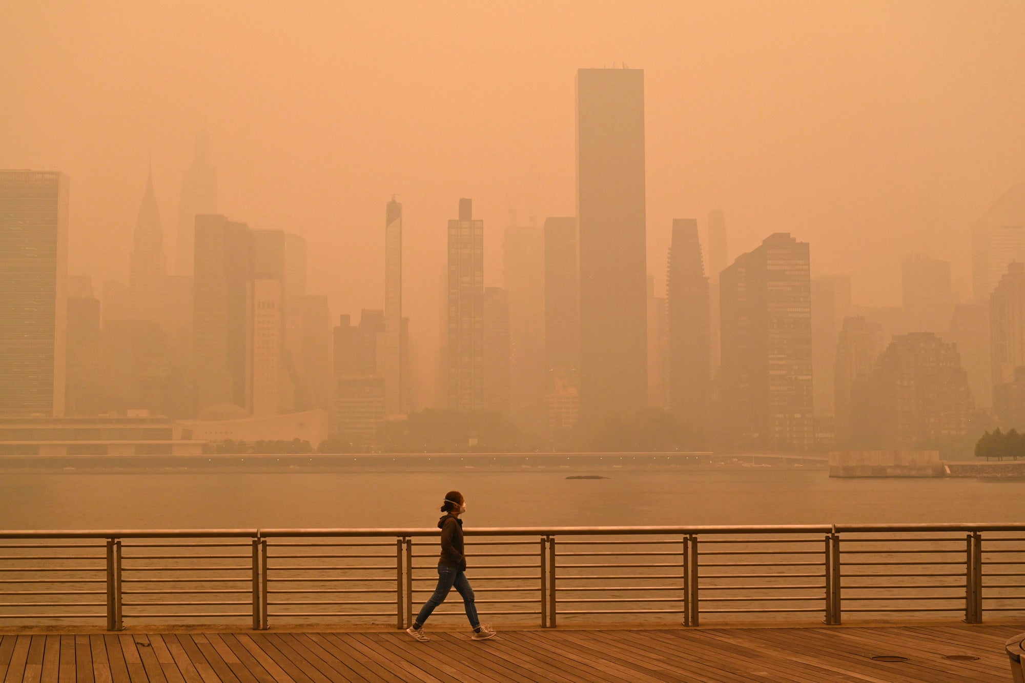 A dark orange haze over the New York skyline