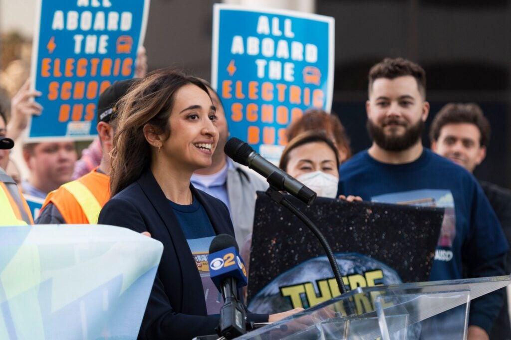 Earthjustice attorney Yasmine Agelidis speaks at a rally for electric school buses outside the Los Angeles Unified School District headquarters in 2022. (Hannah Benet for Earthjustice)